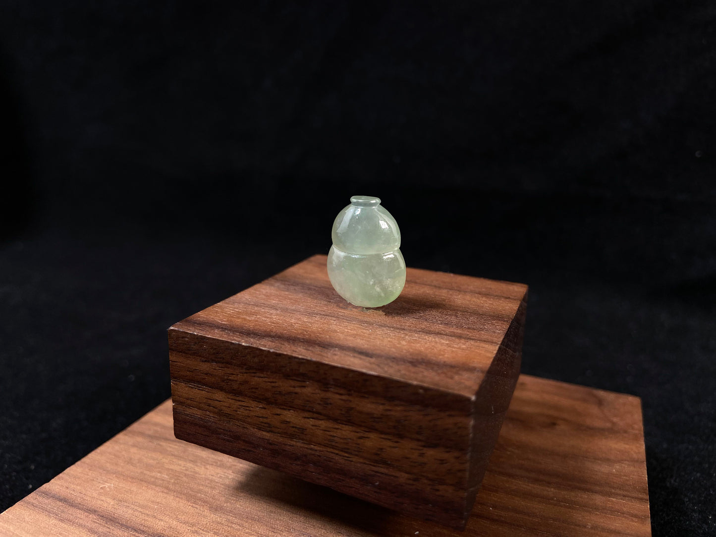 This transparent pale green jade is carved in calabash form.