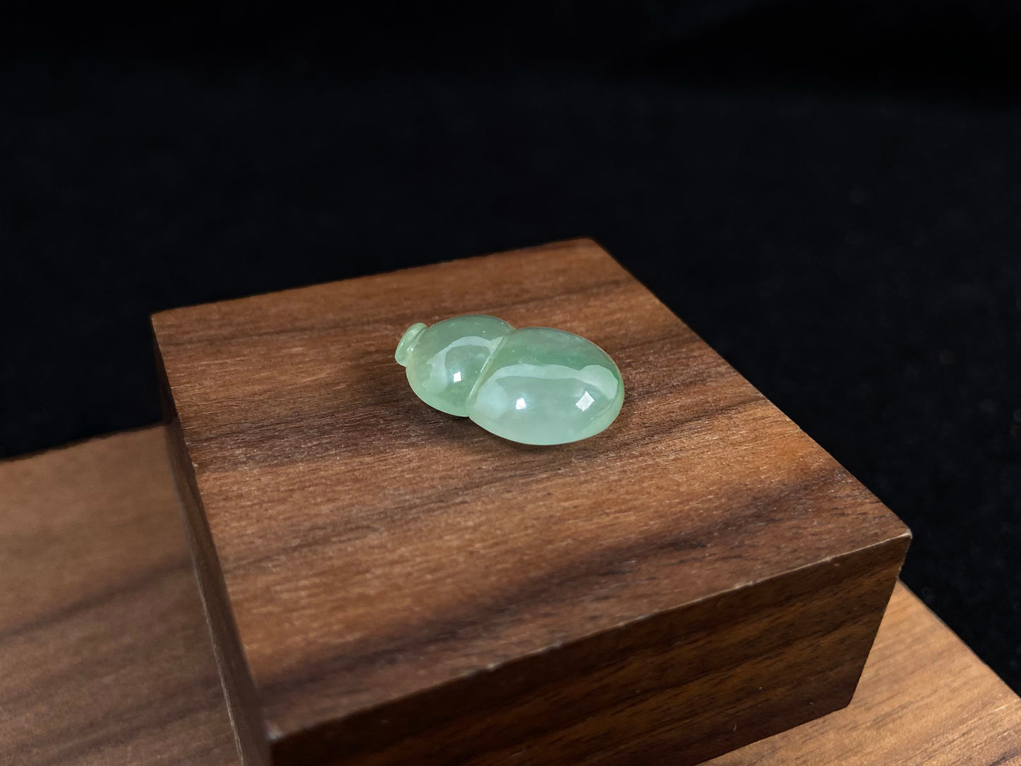 This transparent pale green jade is carved in calabash form.