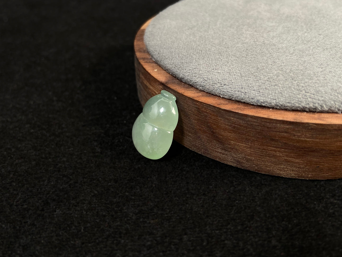 This transparent pale green jade is carved in calabash form.