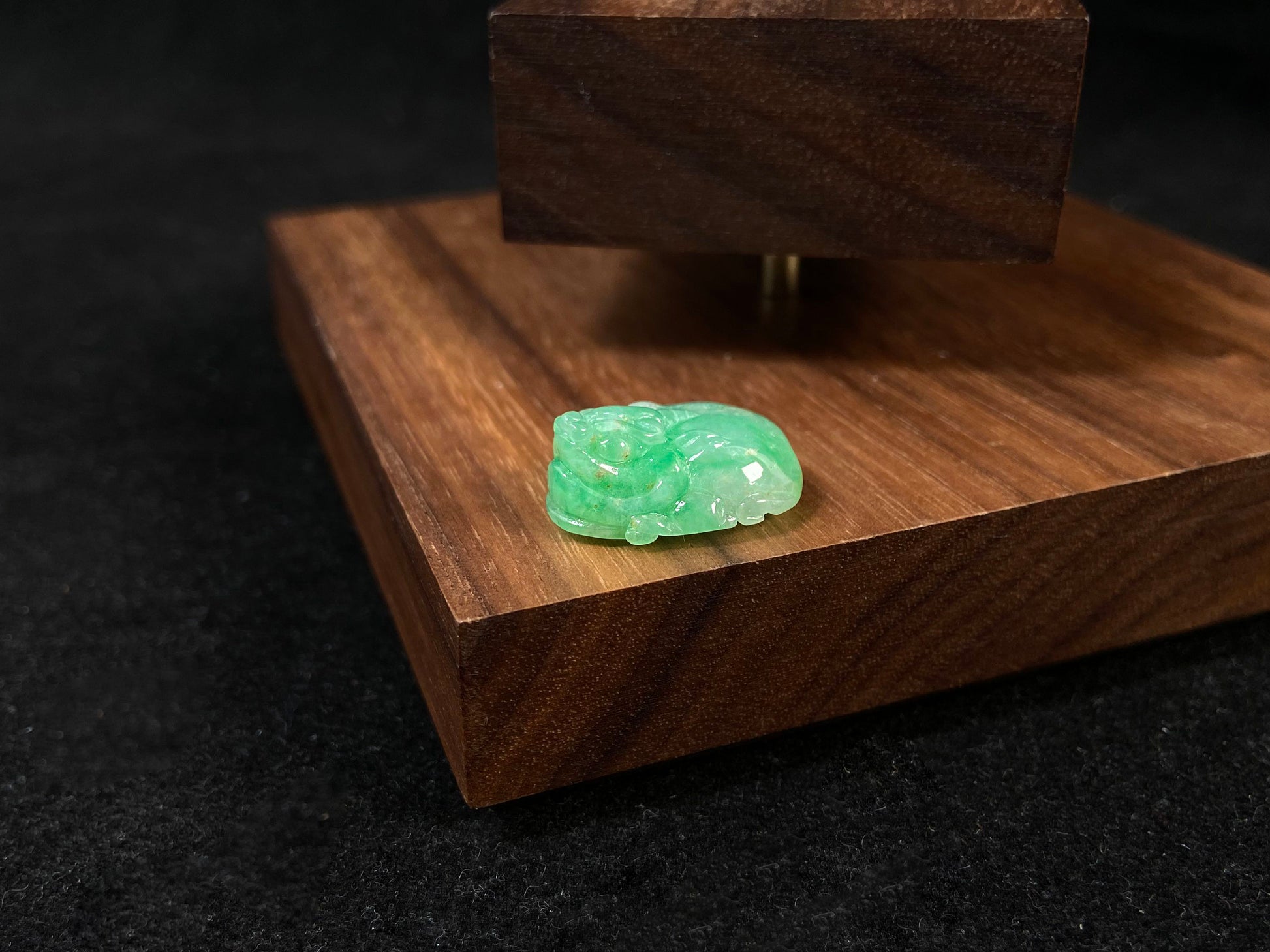 A green jade Pixiu carving.