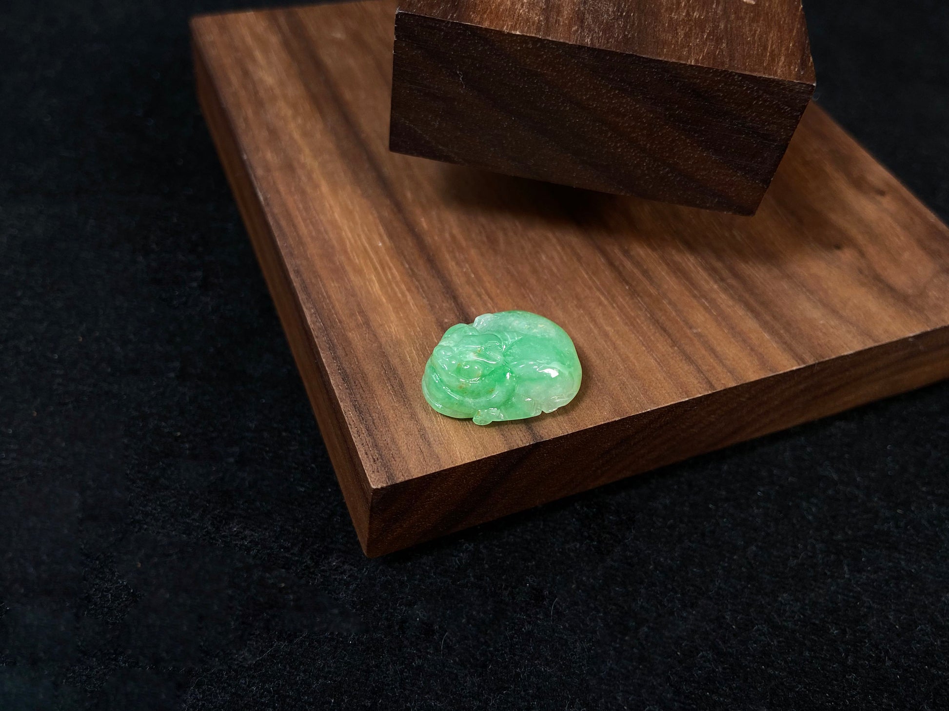 A green jade Pixiu carving.