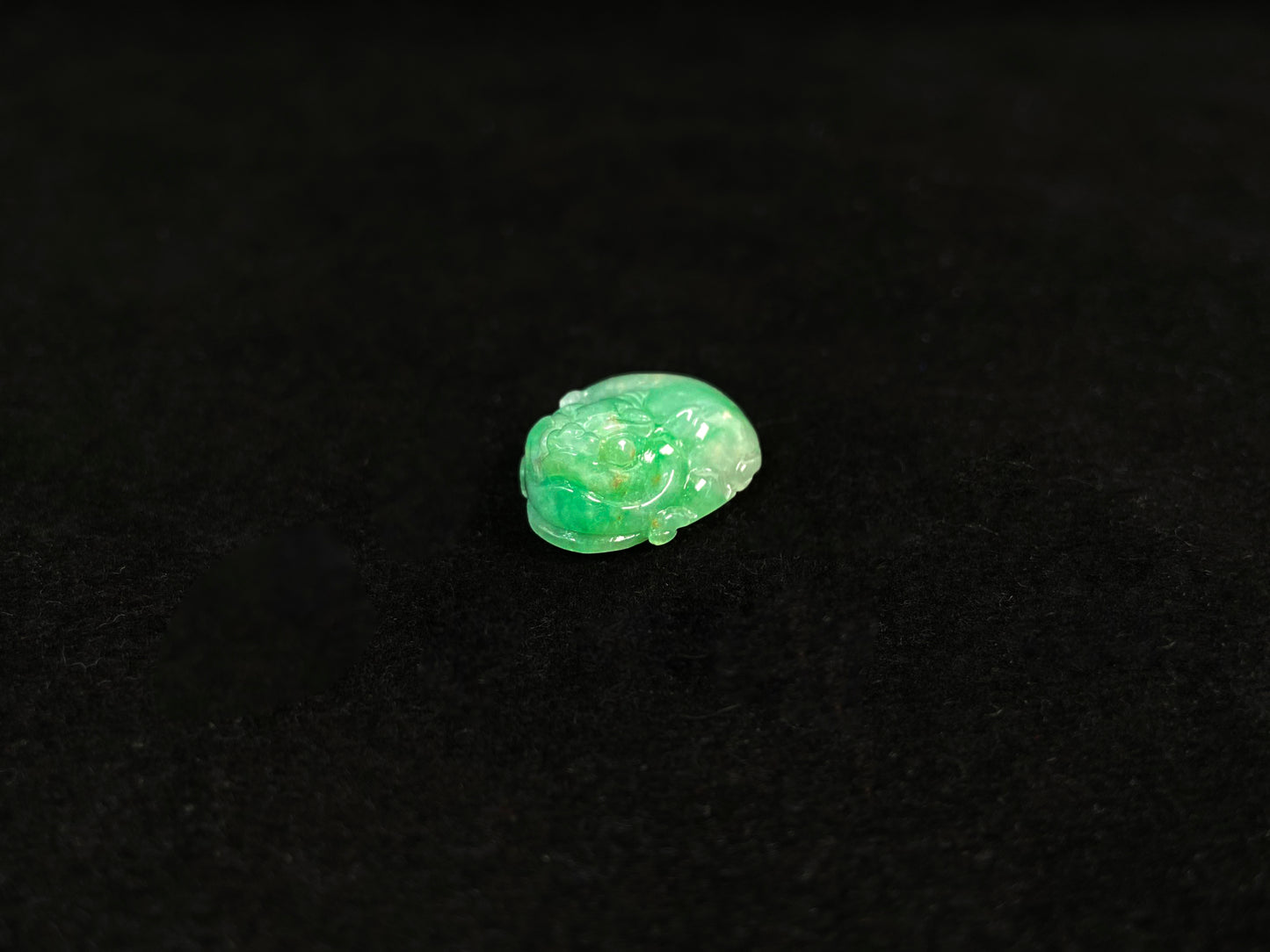 A green jade Pixiu carving.