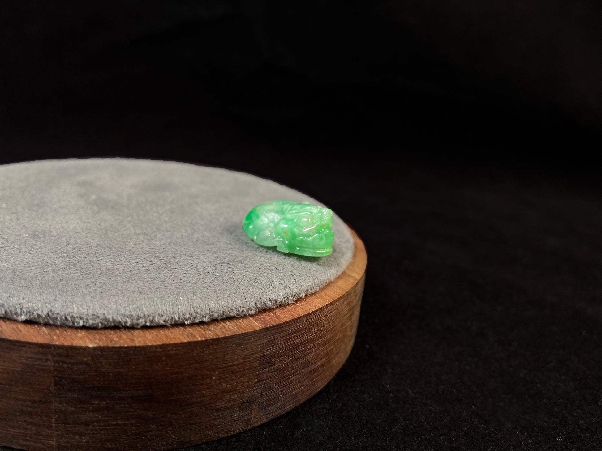 A green jade Pixiu carving.