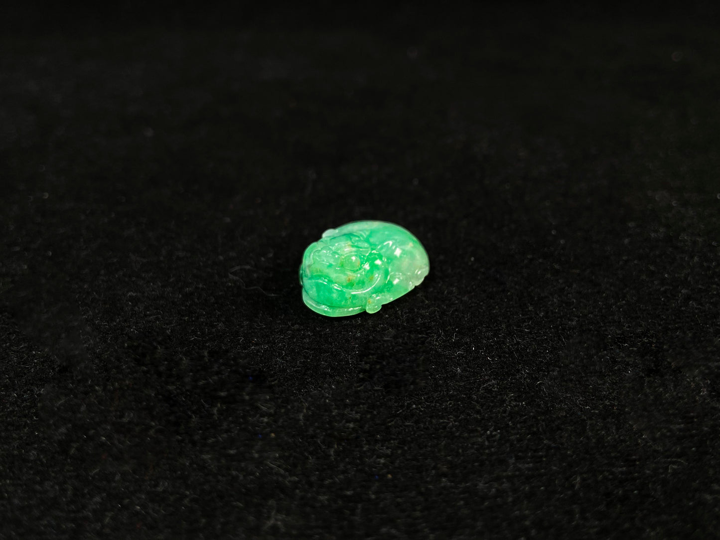 A green jade Pixiu carving.