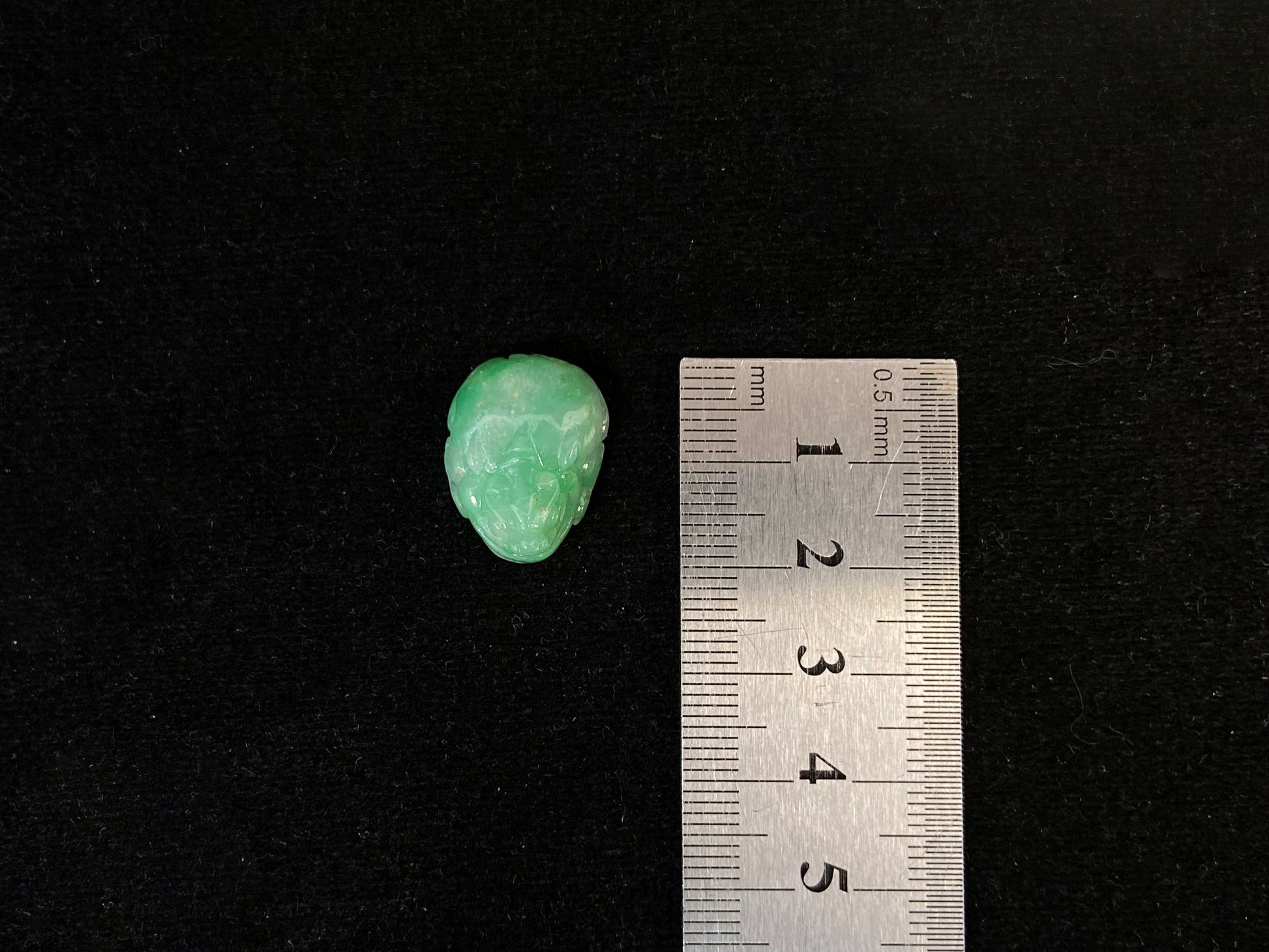 A green jade Pixiu carving.