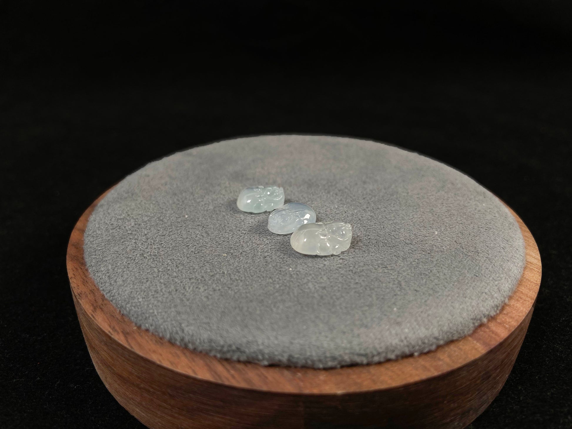 Three front-facing Pixiu carvings in icy jadeite.