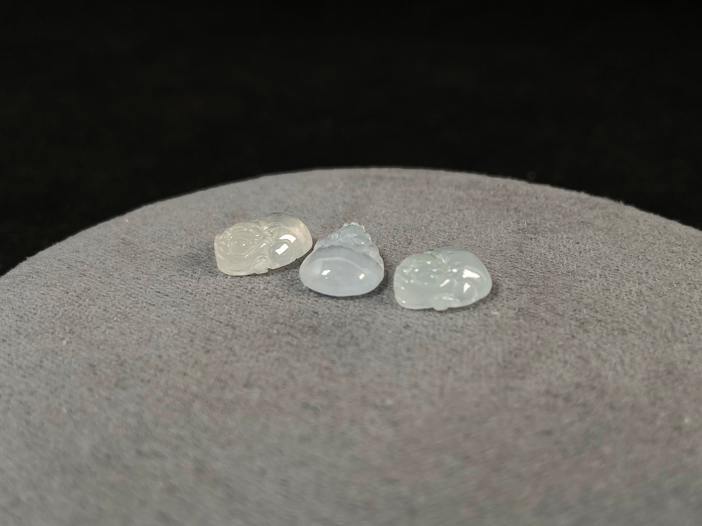 Three front-facing Pixiu carvings in icy jadeite.