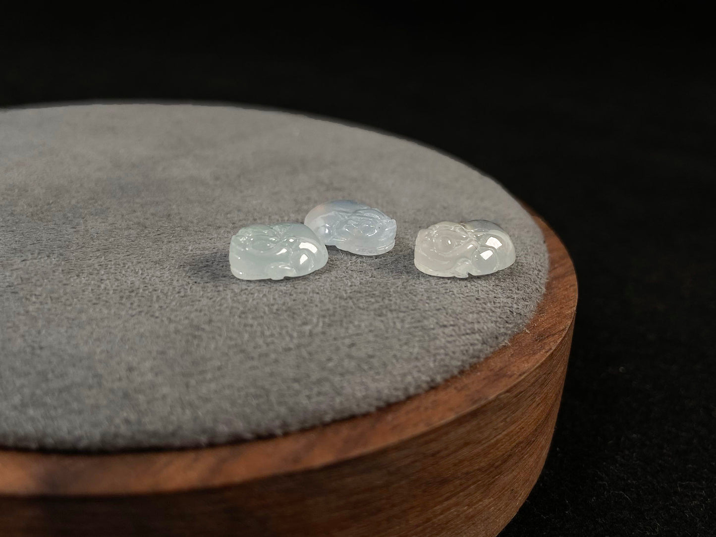 Three front-facing Pixiu carvings in icy jadeite.