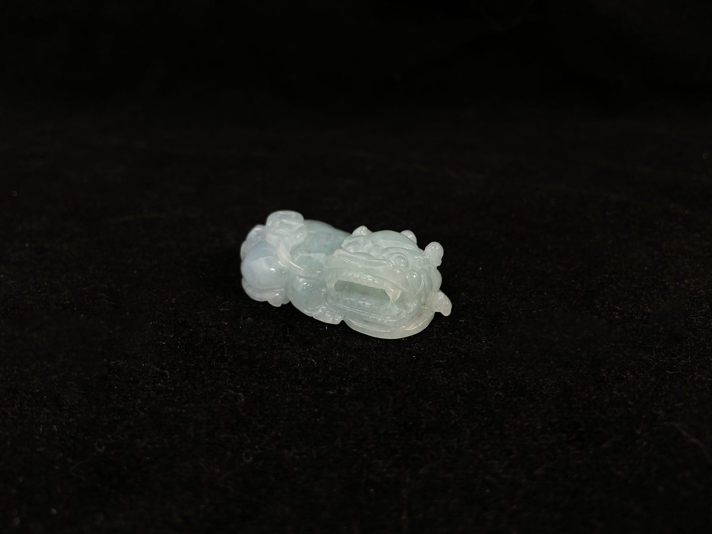 A light green translucent jade Pi Xiu carving.