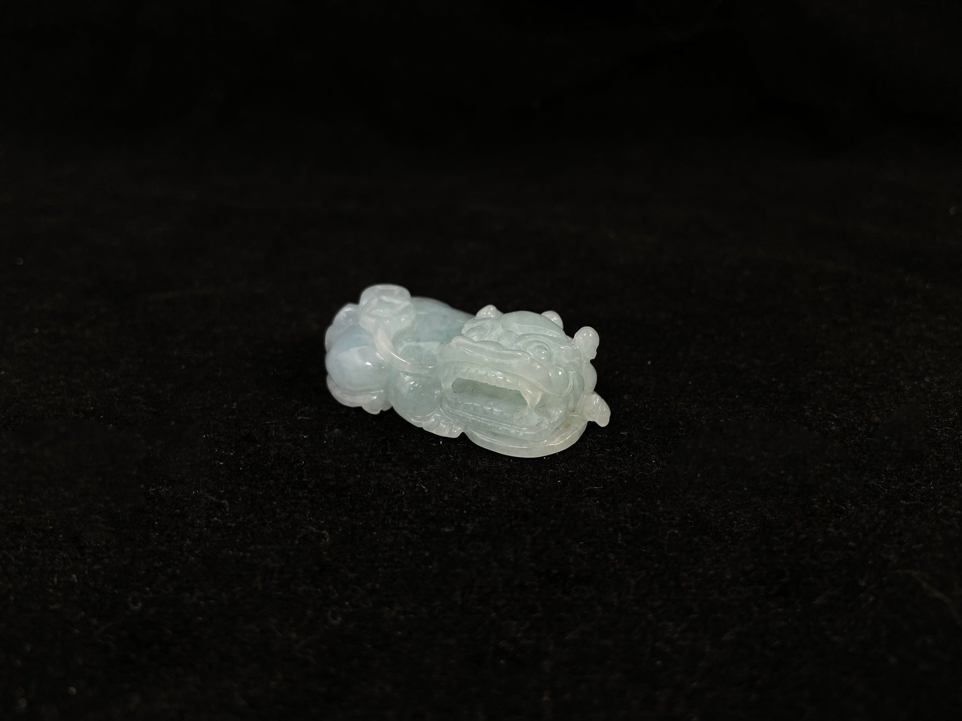 A light green translucent jade Pi Xiu carving.