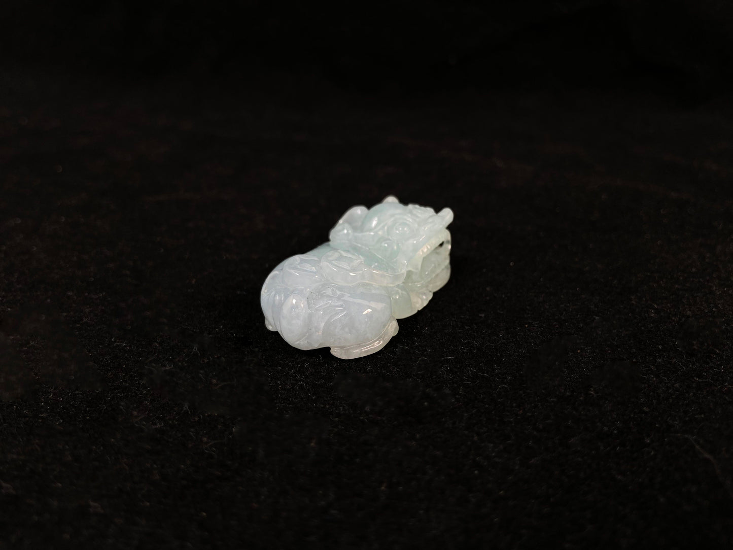 A light green translucent jade Pi Xiu carving.
