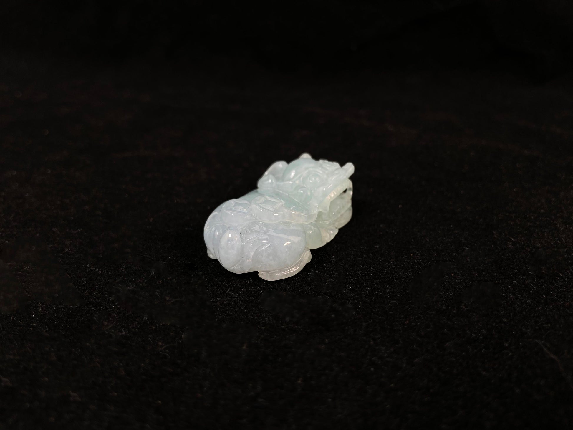 A light green translucent jade Pi Xiu carving.