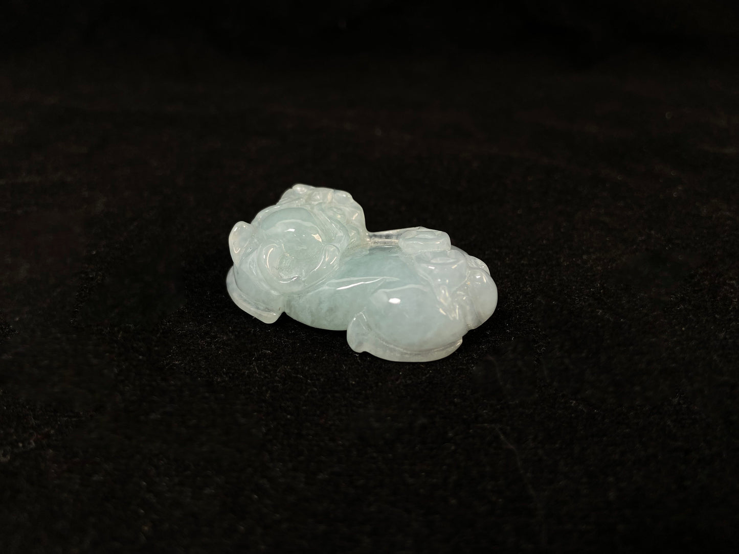 A light green translucent jade Pi Xiu carving.