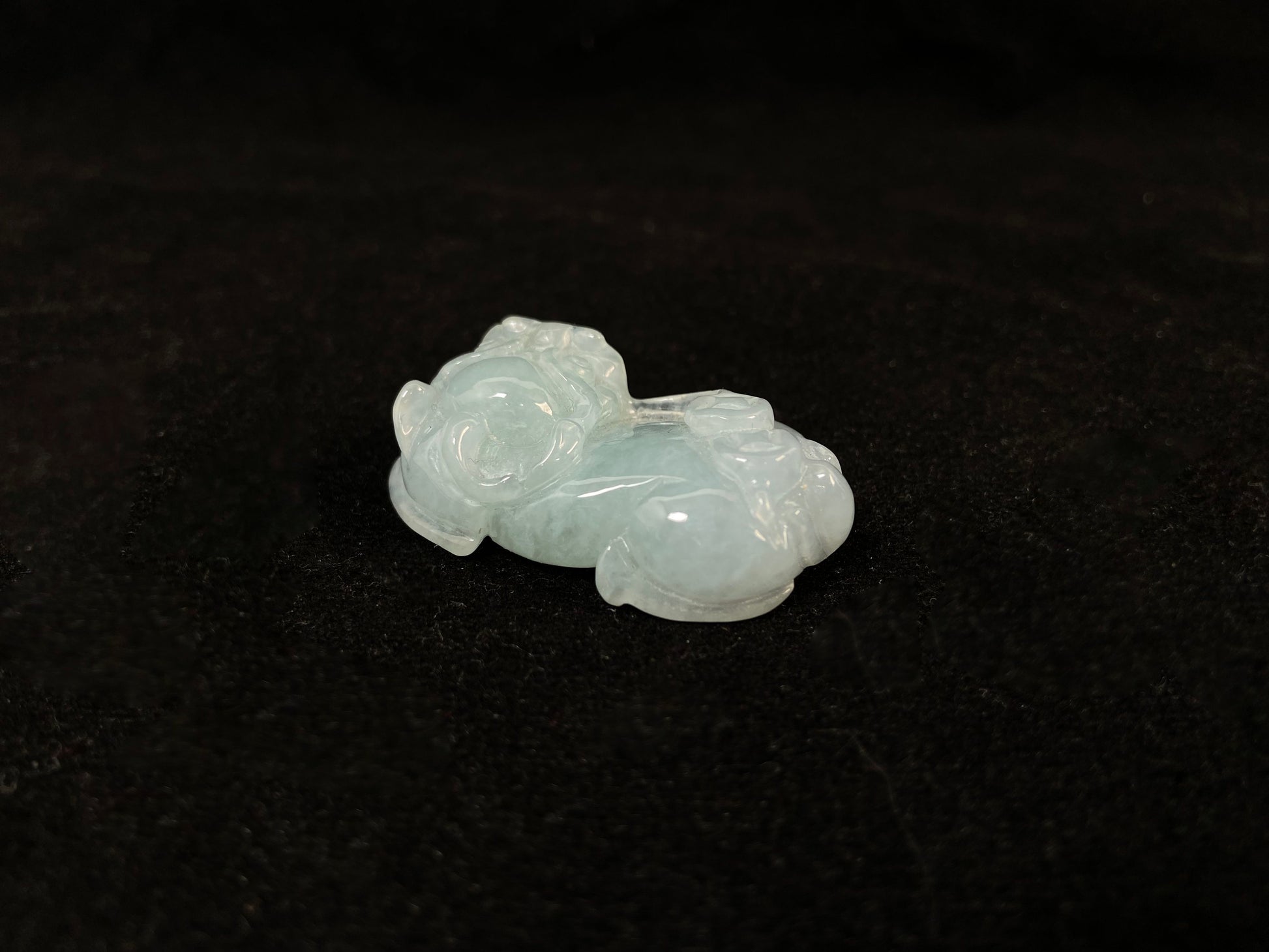 A light green translucent jade Pi Xiu carving.