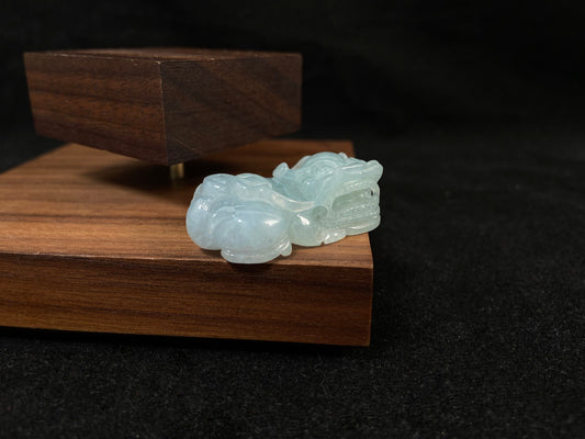 A light green translucent jade Pi Xiu carving.