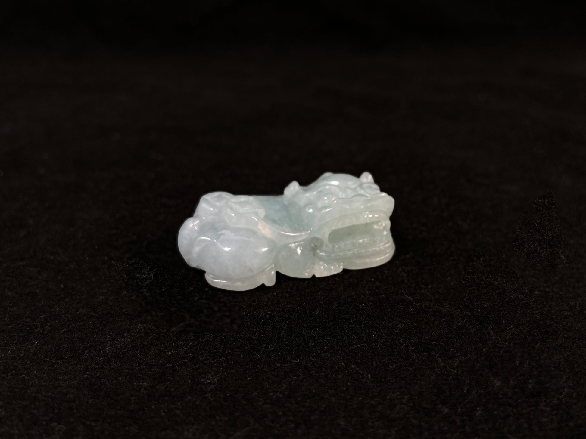 A light green translucent jade Pi Xiu carving.