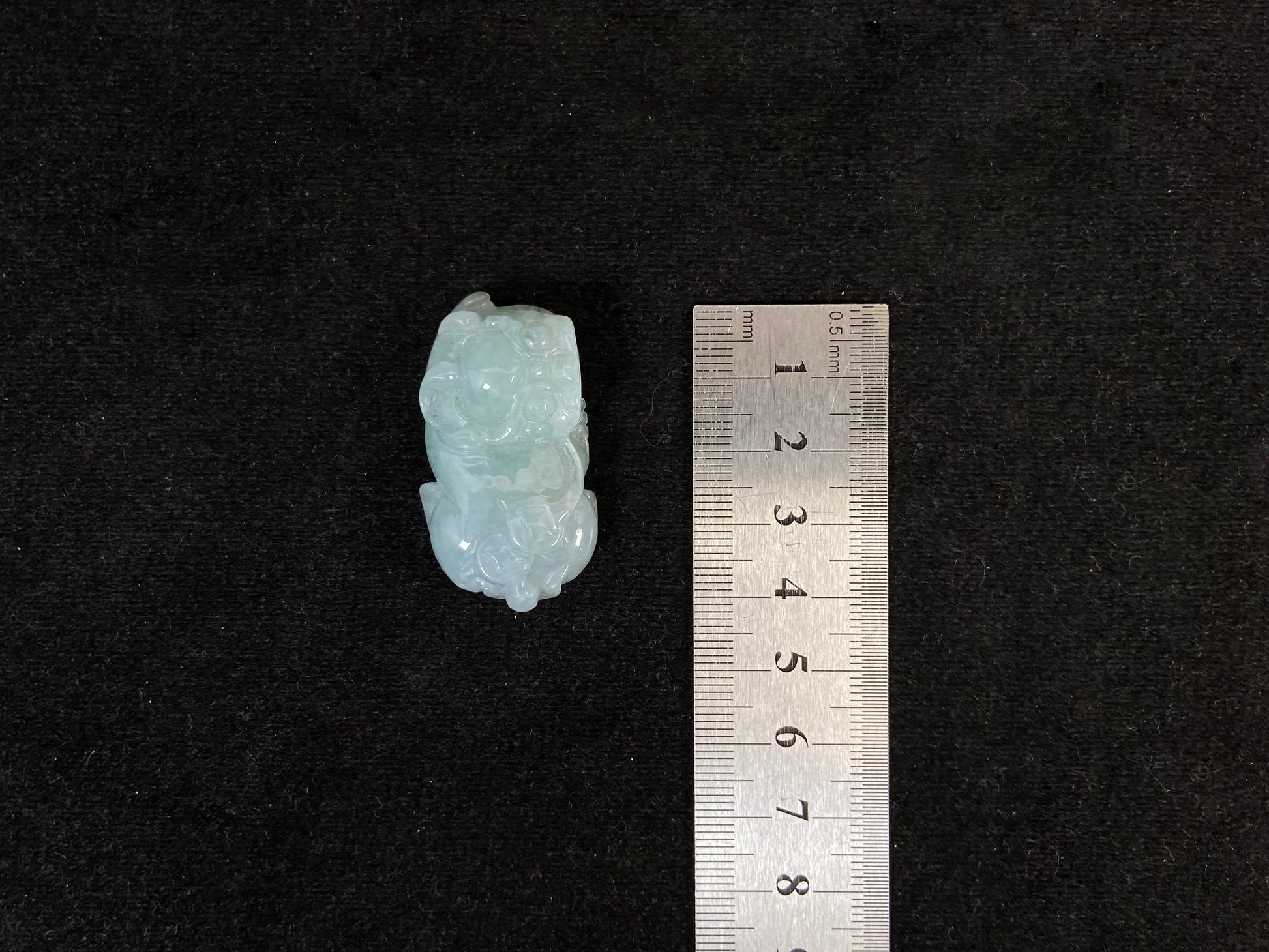 A light green translucent jade Pi Xiu carving.