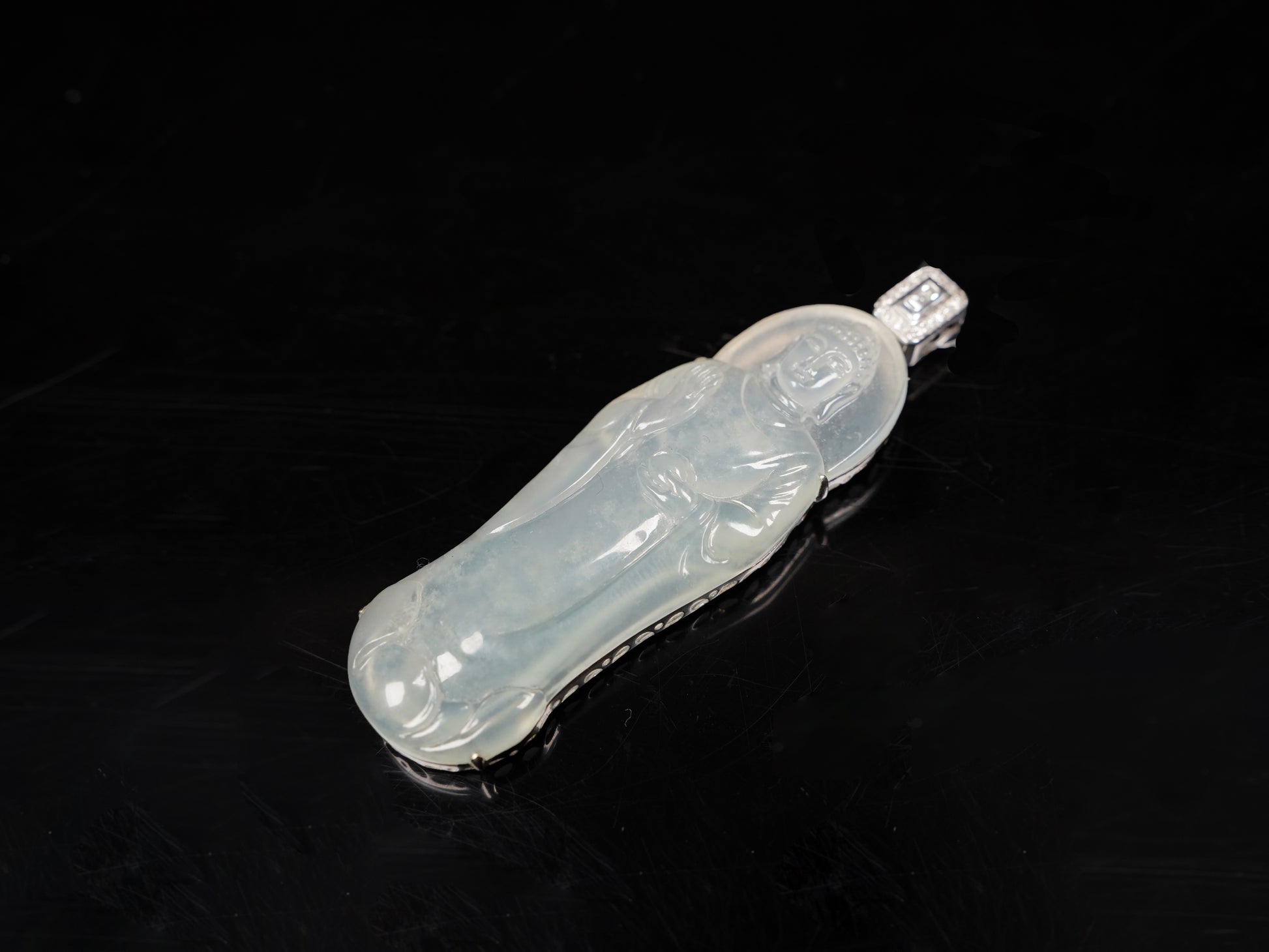 A Icy Pale Green Guanyin Loose Jadeite.
