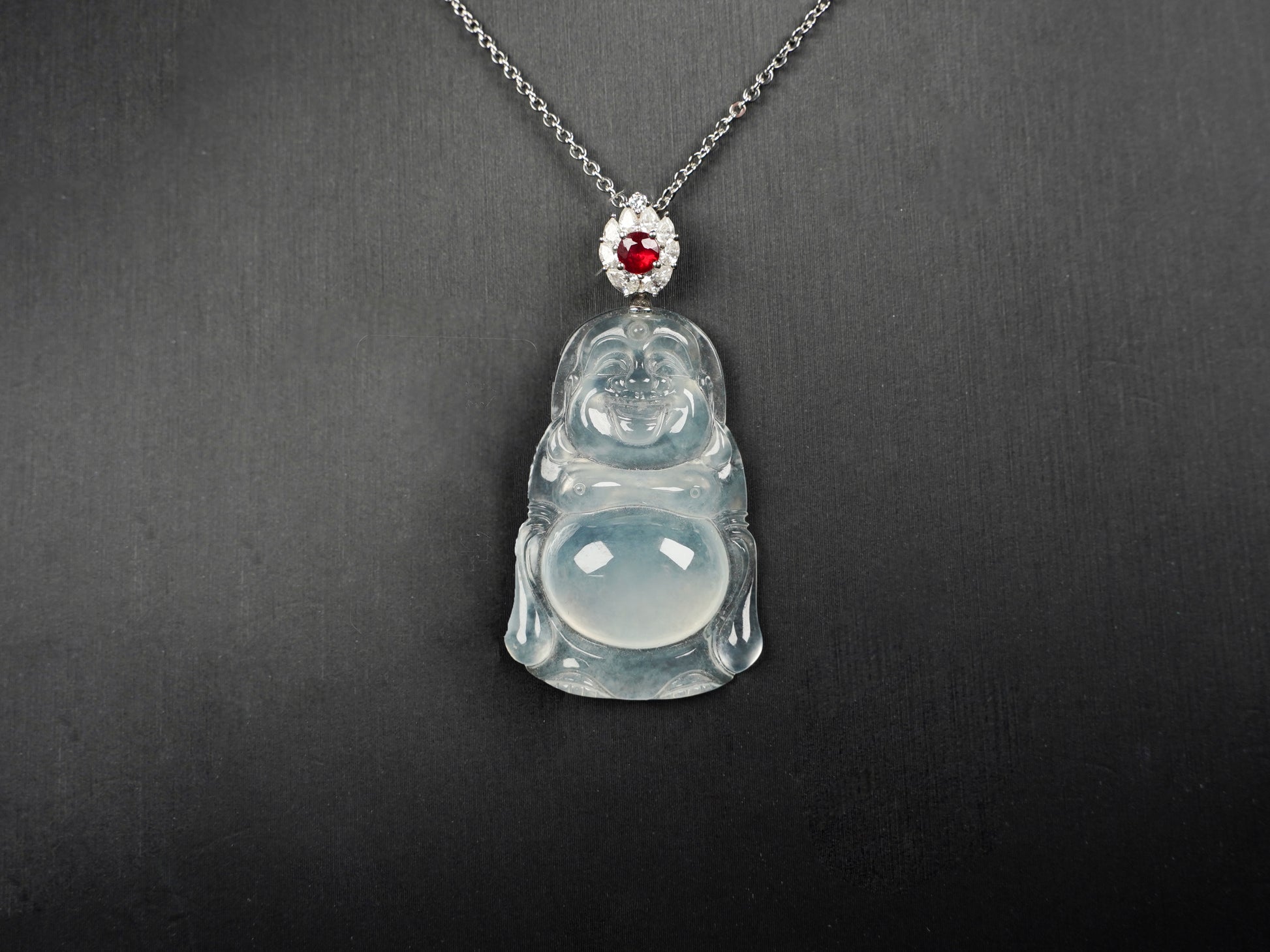 This icy jadeite Buddha pendant.