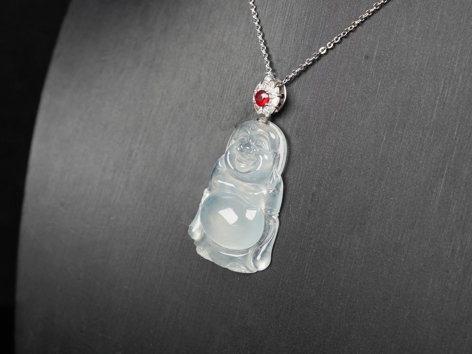 This icy jadeite Buddha pendant.