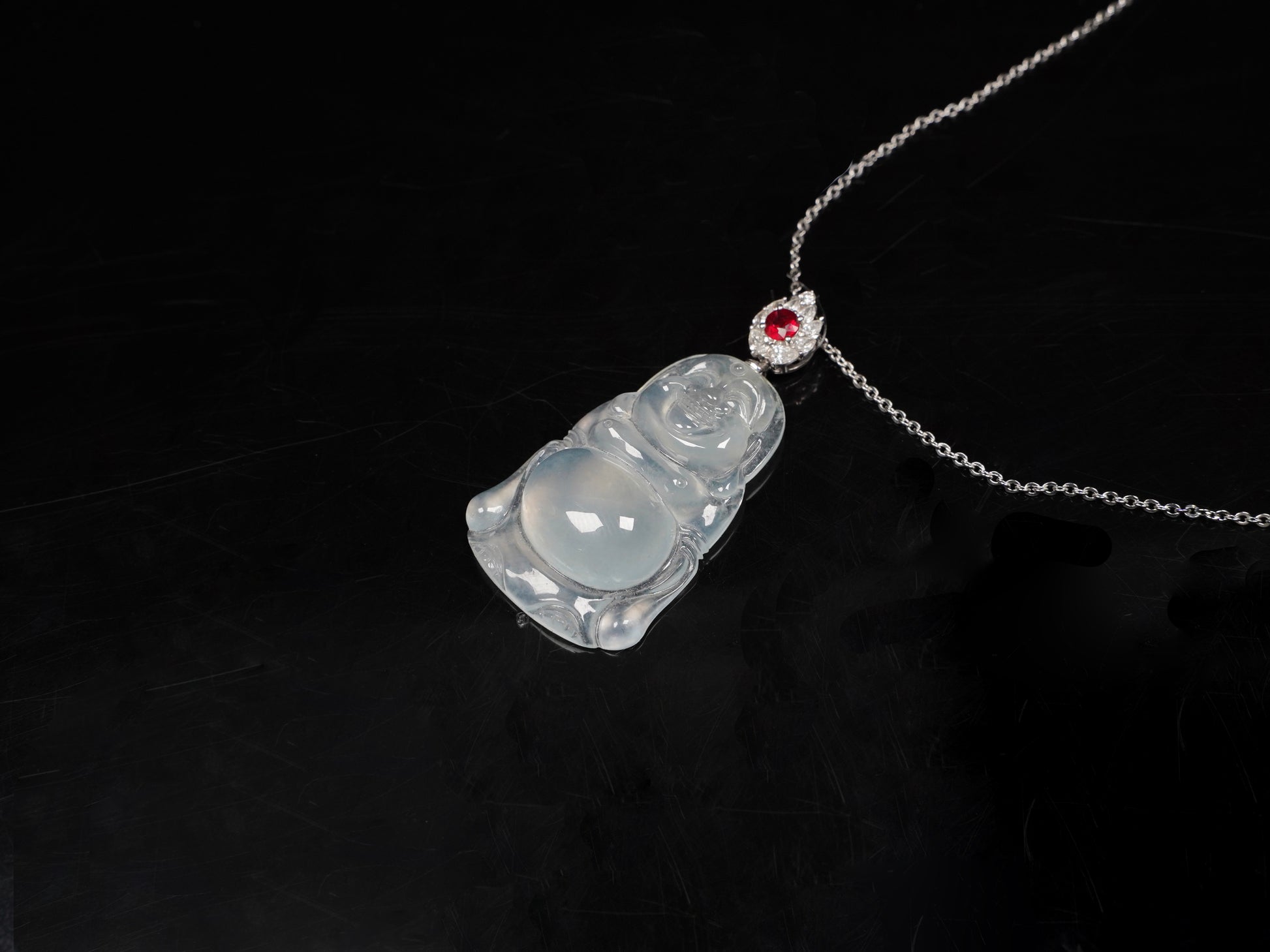 This icy jadeite Buddha pendant.