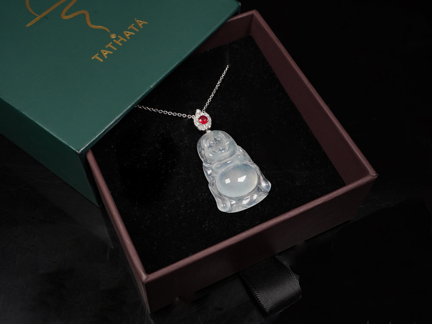 This icy jadeite Buddha pendant.