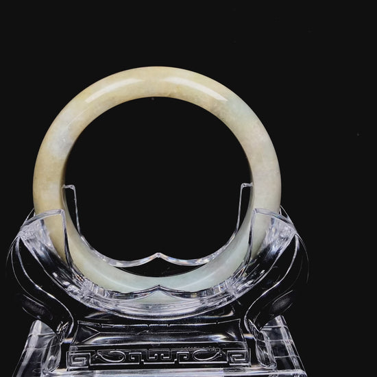Golden shimmers sprinkling lightly jadeite bangle.