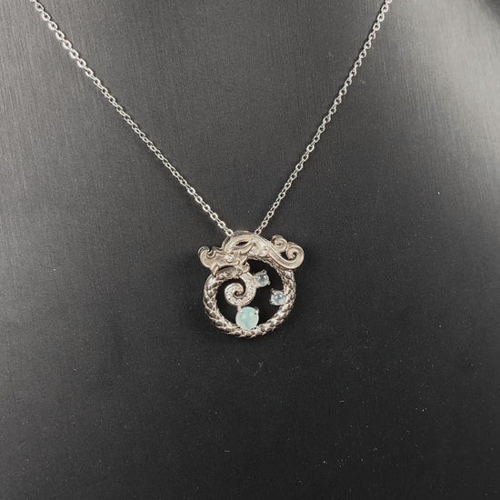 A icy blue coiled dragon jadeite pendant.