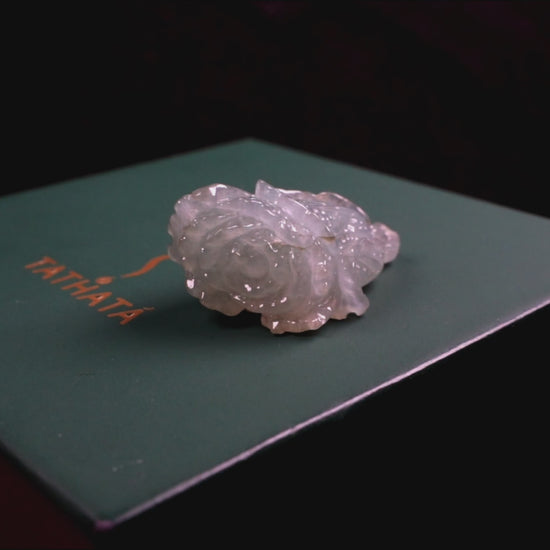 A delicate icy light green cabbage loose jadeite.