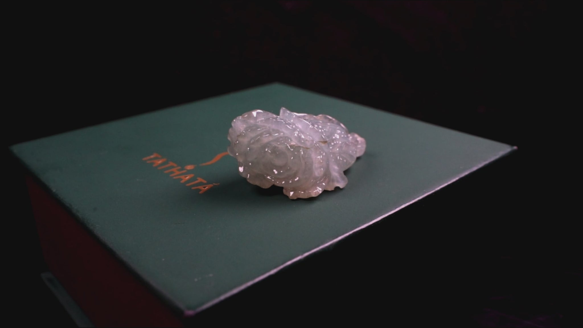 A delicate icy light green cabbage loose jadeite.