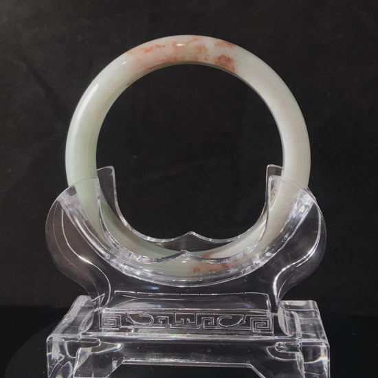 A pale spring green mist jadeite bangle.