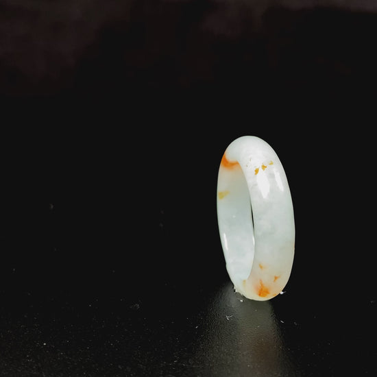 A icy white with amber hue jadeite ring.