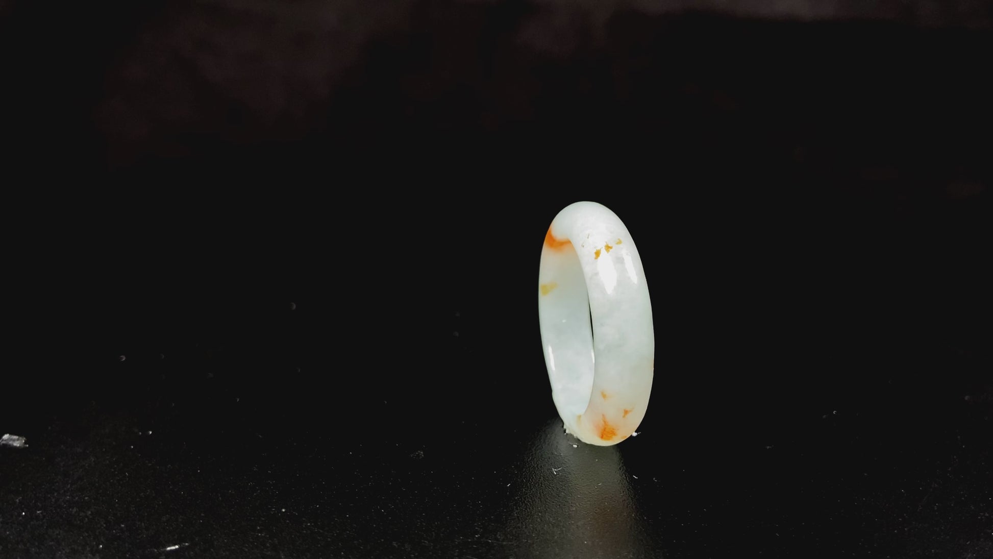 A icy white with amber hue jadeite ring.