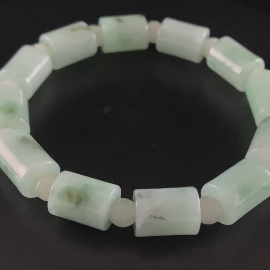 A mint green barrel beads bracelet.