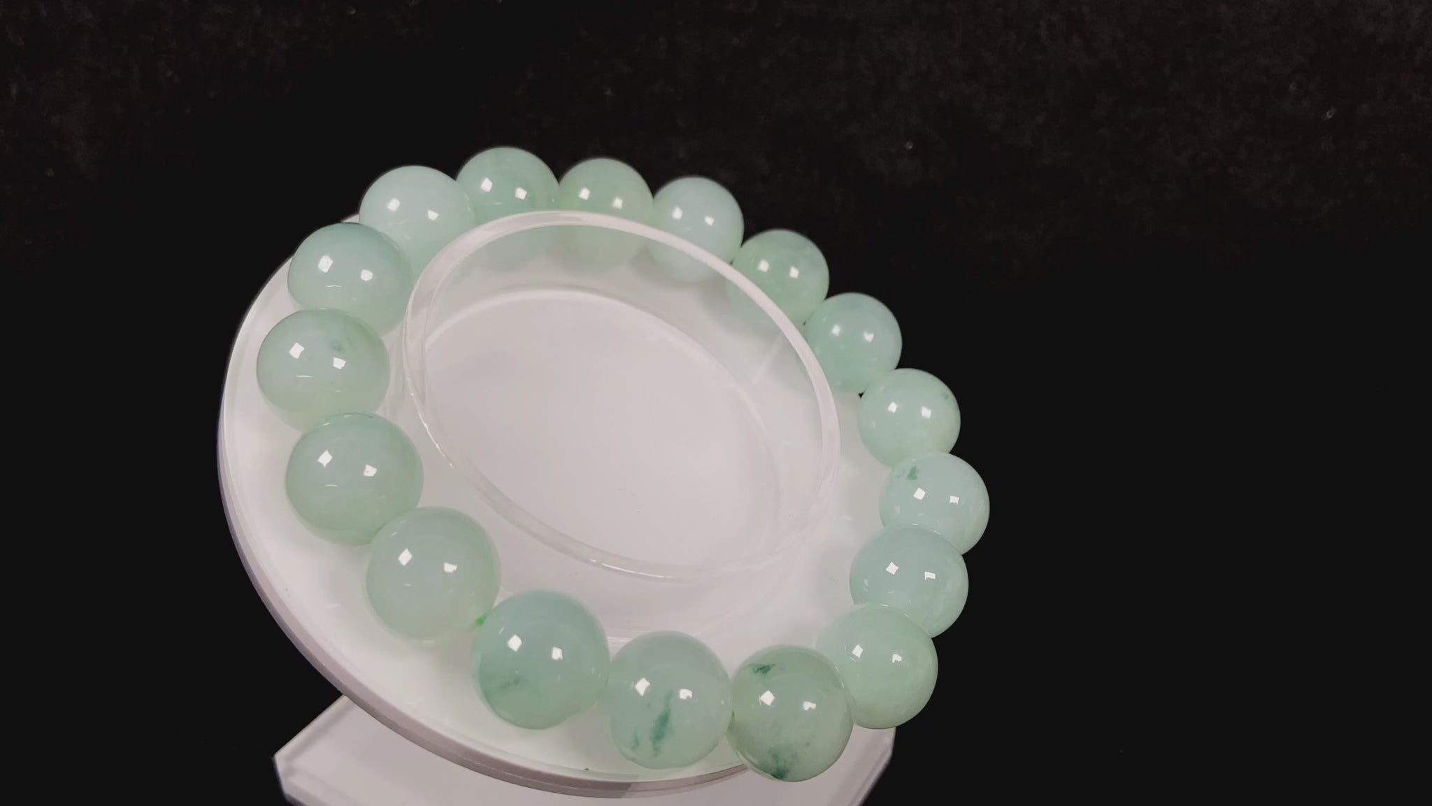 A translucent green with forest fleck  jadeite beads bracelet.