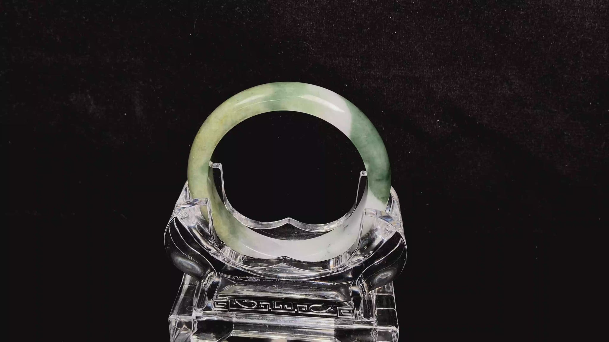 A verdant gold silken white  jadeite bangle.