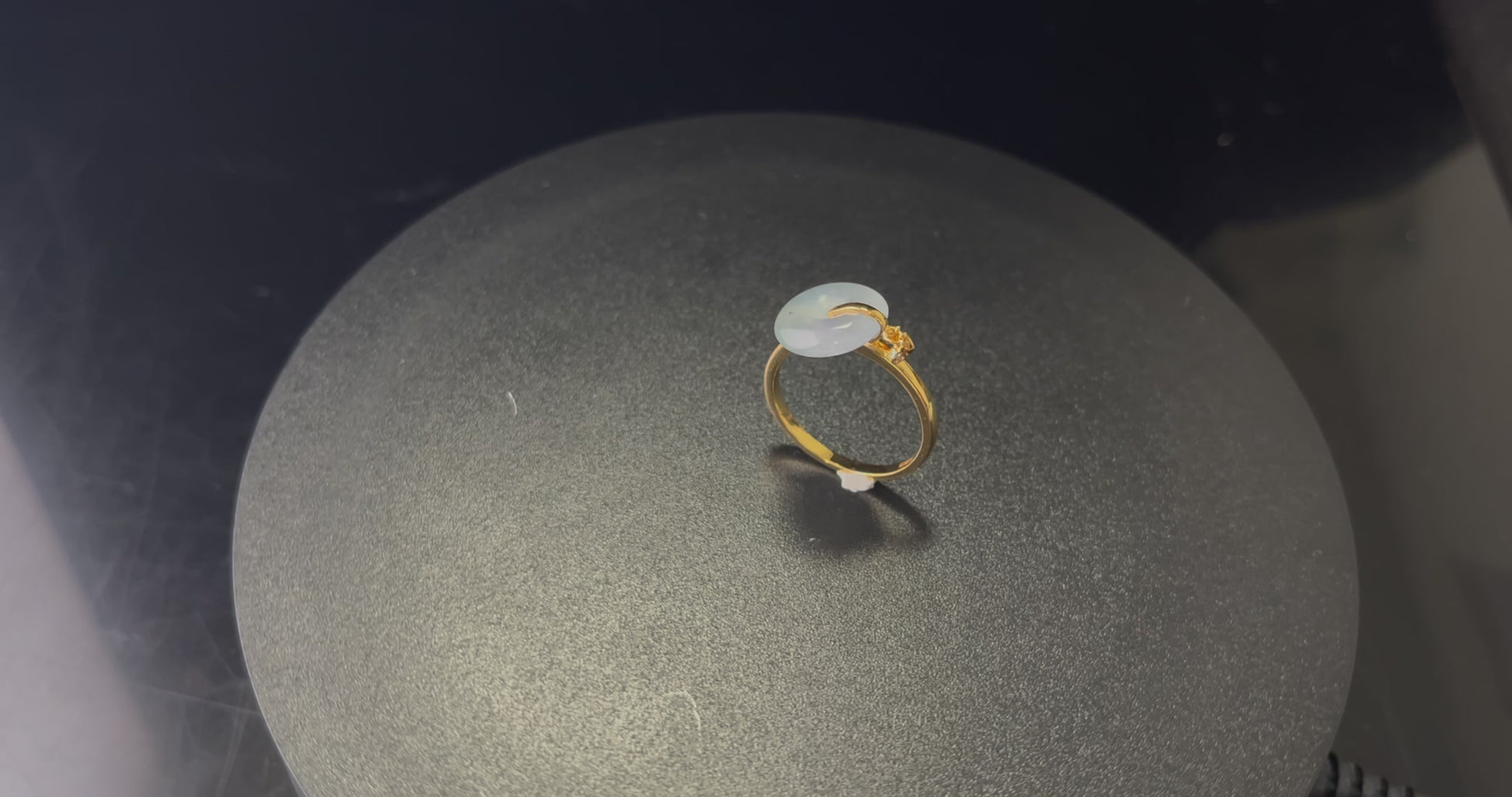 A green frost peace button jadeite ring.