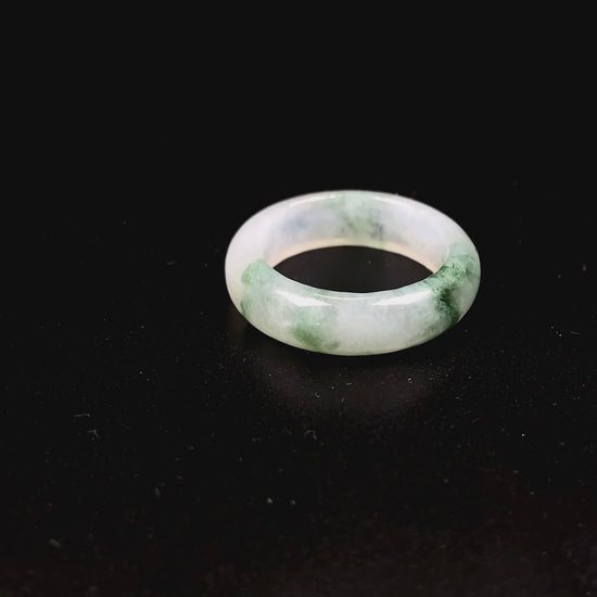 A misty base with green shadow jadeite ring.