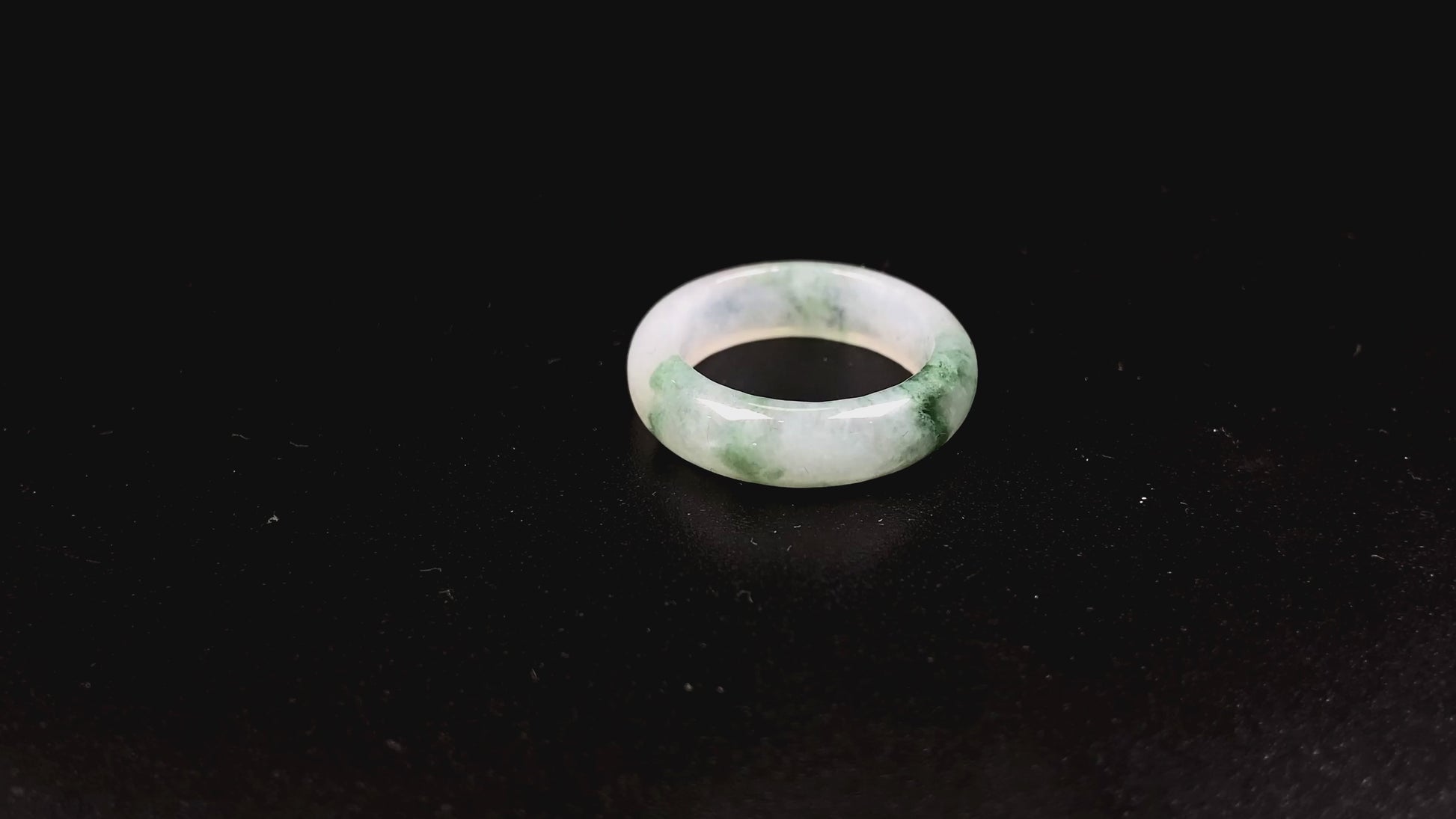 A misty base with green shadow jadeite ring.