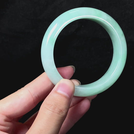 A apple green crisp bloom jadeite bangle.