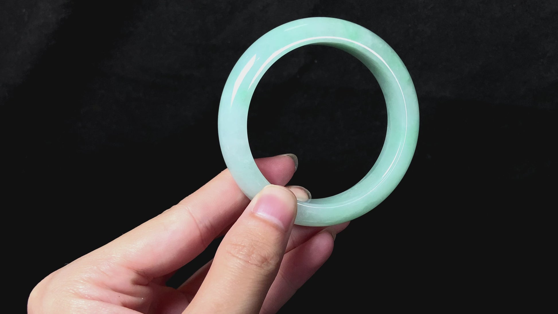 A apple green crisp bloom jadeite bangle.