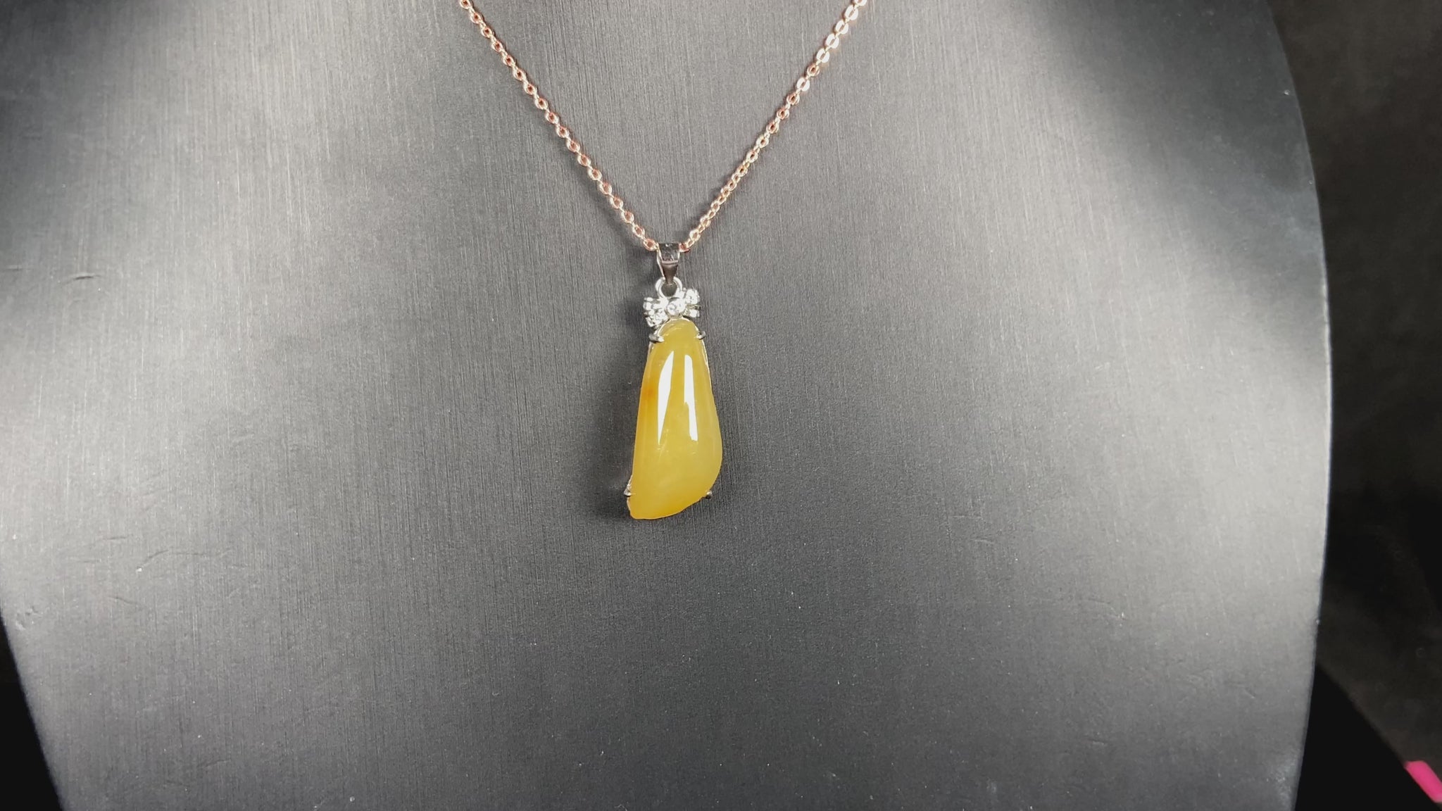 A vibrant yellow fortune melon jadeite pendant.