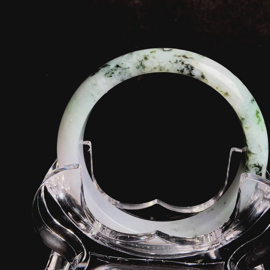 A misty green peaks jadeite bangle.