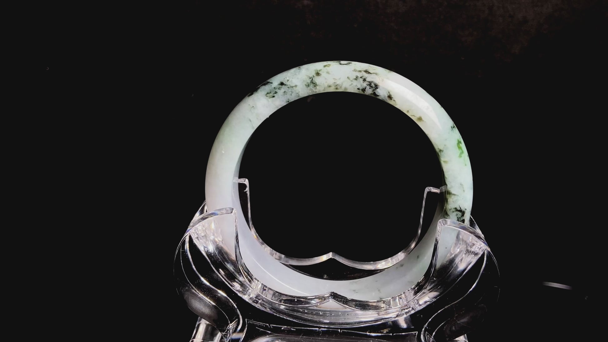 A misty green peaks jadeite bangle.