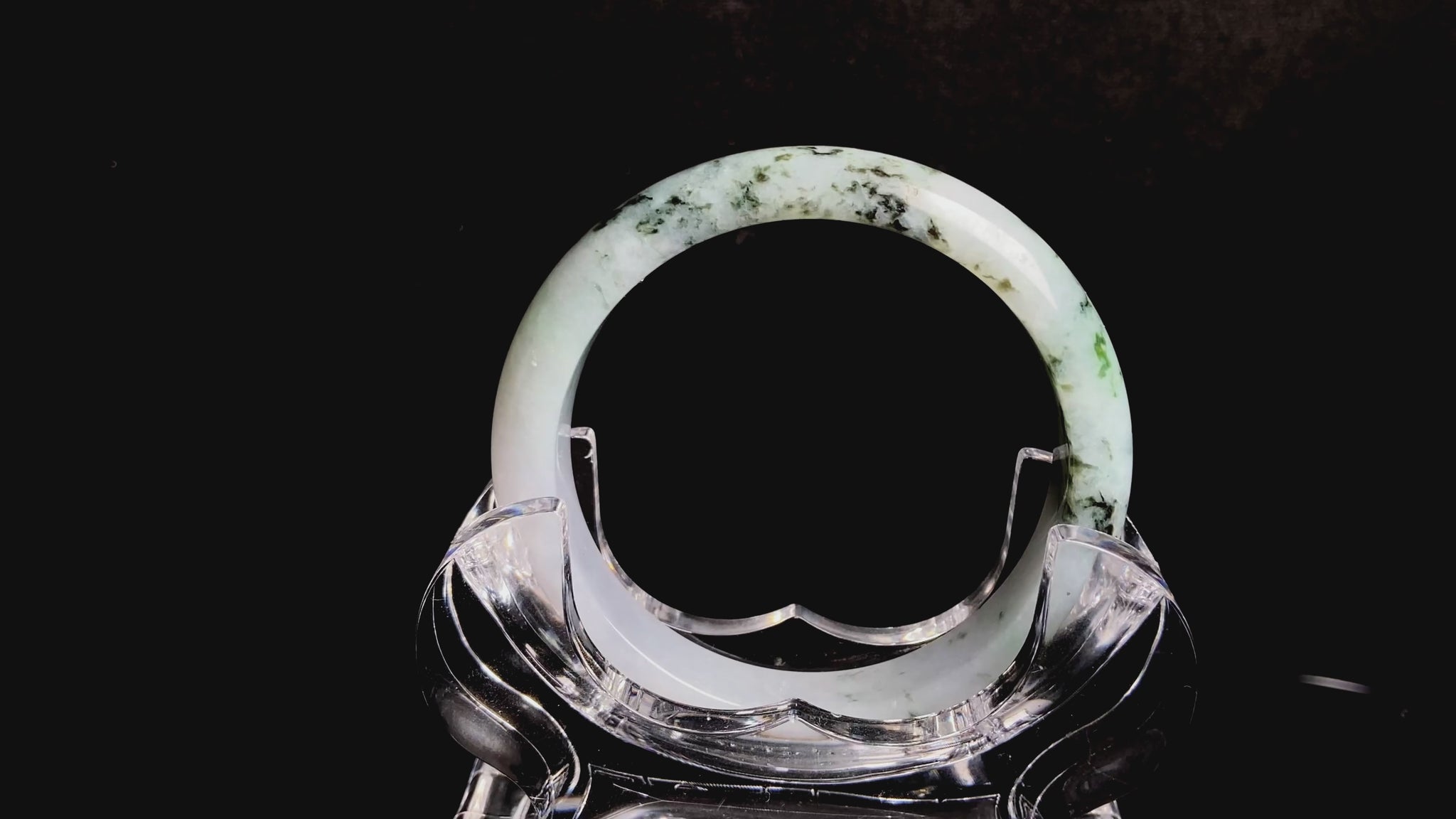 A misty green peaks jadeite bangle.