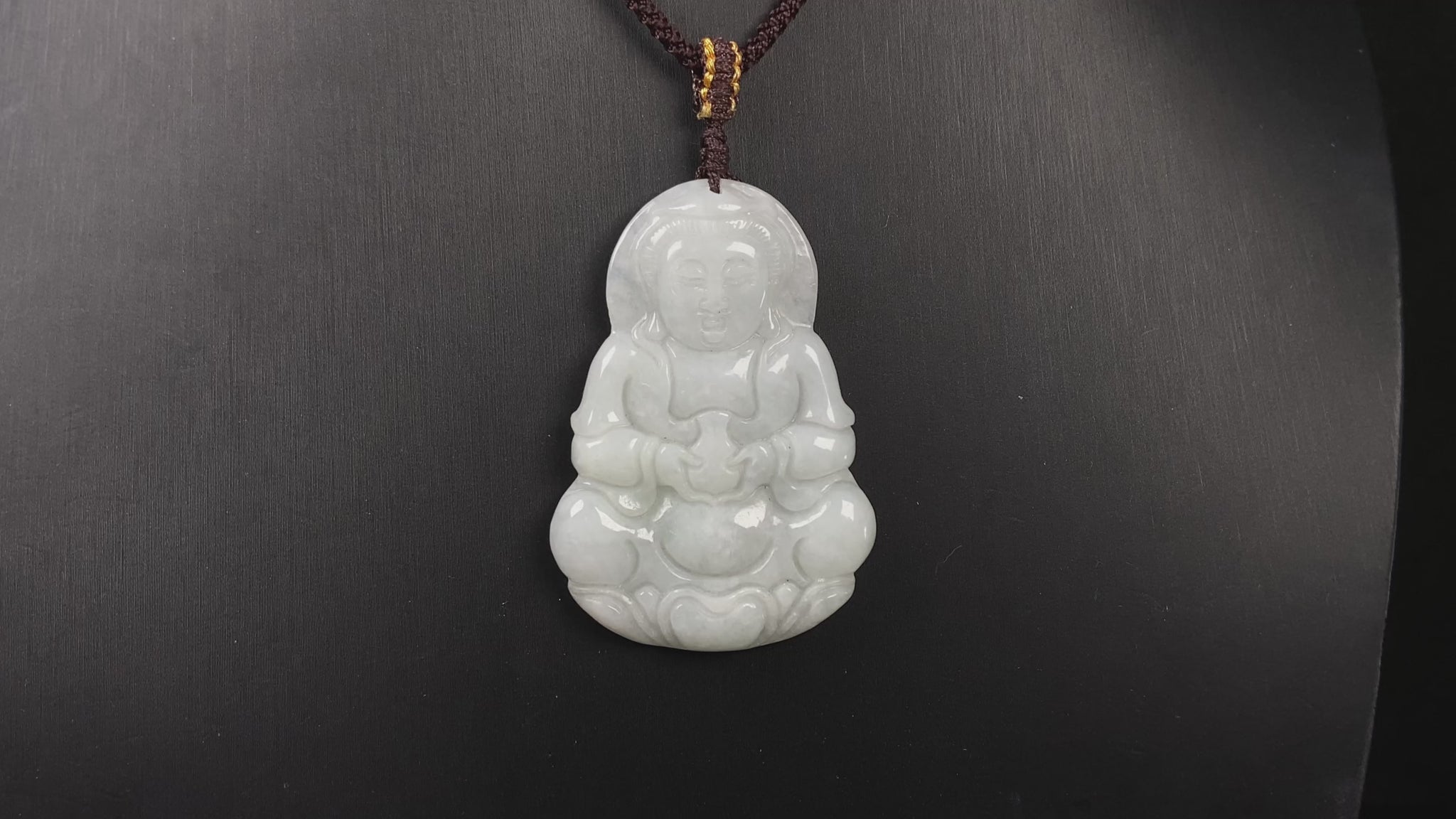 A purple green Guanyin blessing jadeite pendant.