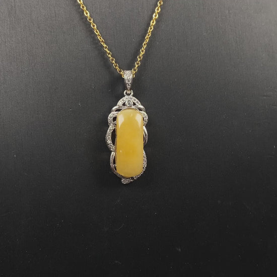 A gentle wheat yellow jadeite pendant.