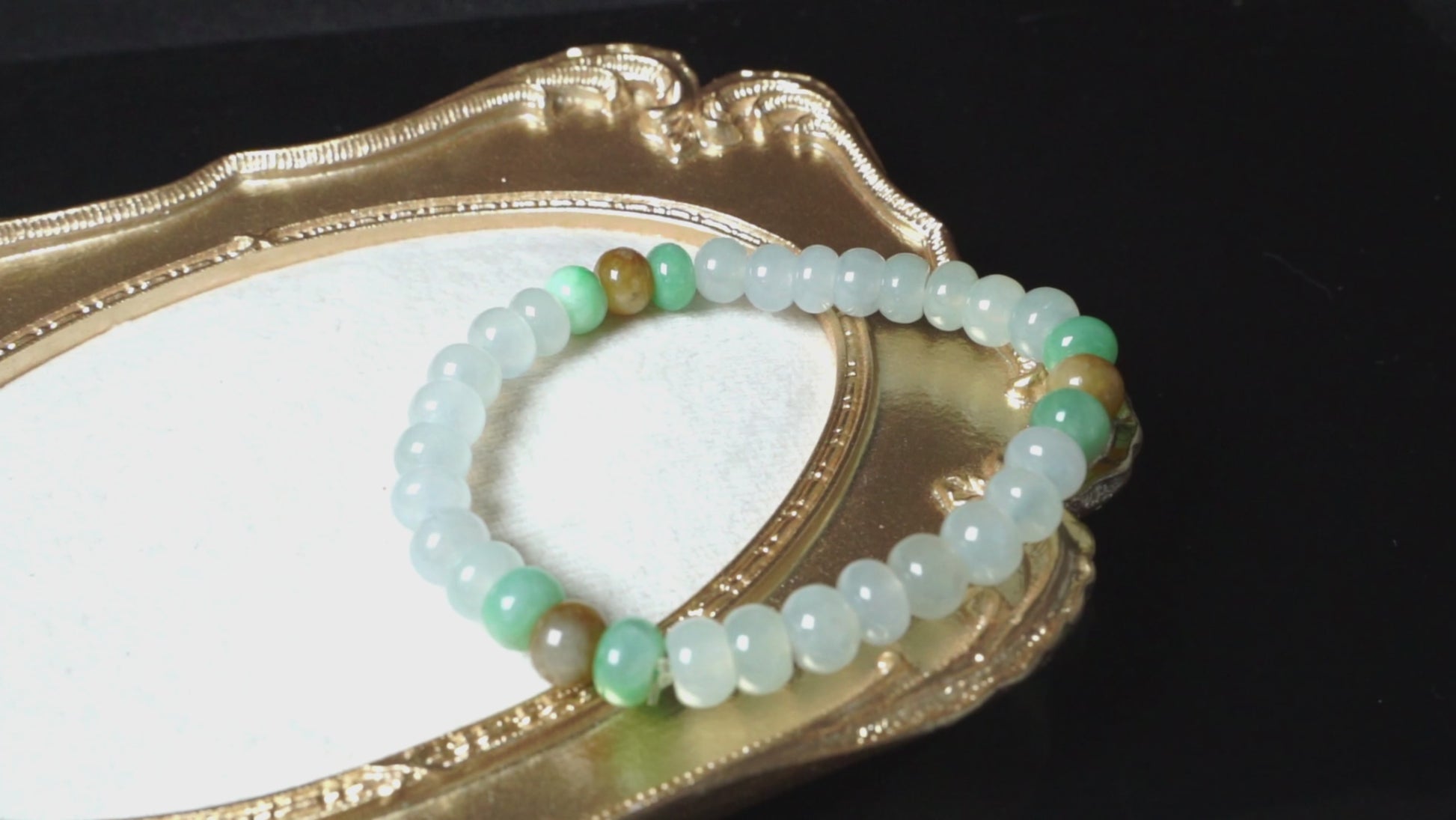 A glacial ice with green and amber accents jadeite beads bracelet.
