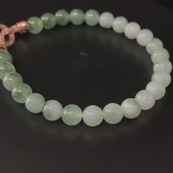 A floating green gradient jadeite beads bracelet.