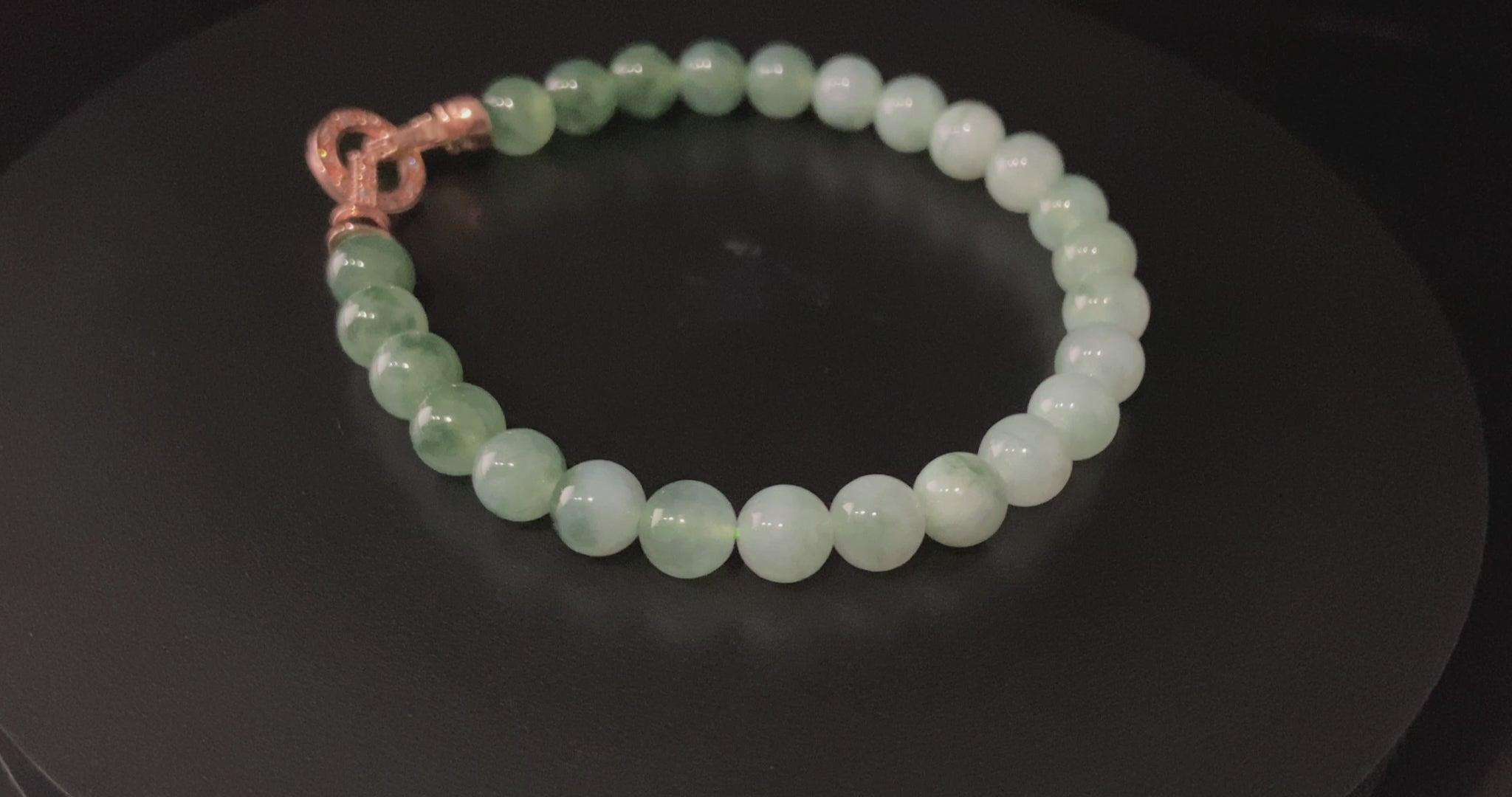 A floating green gradient jadeite beads bracelet.